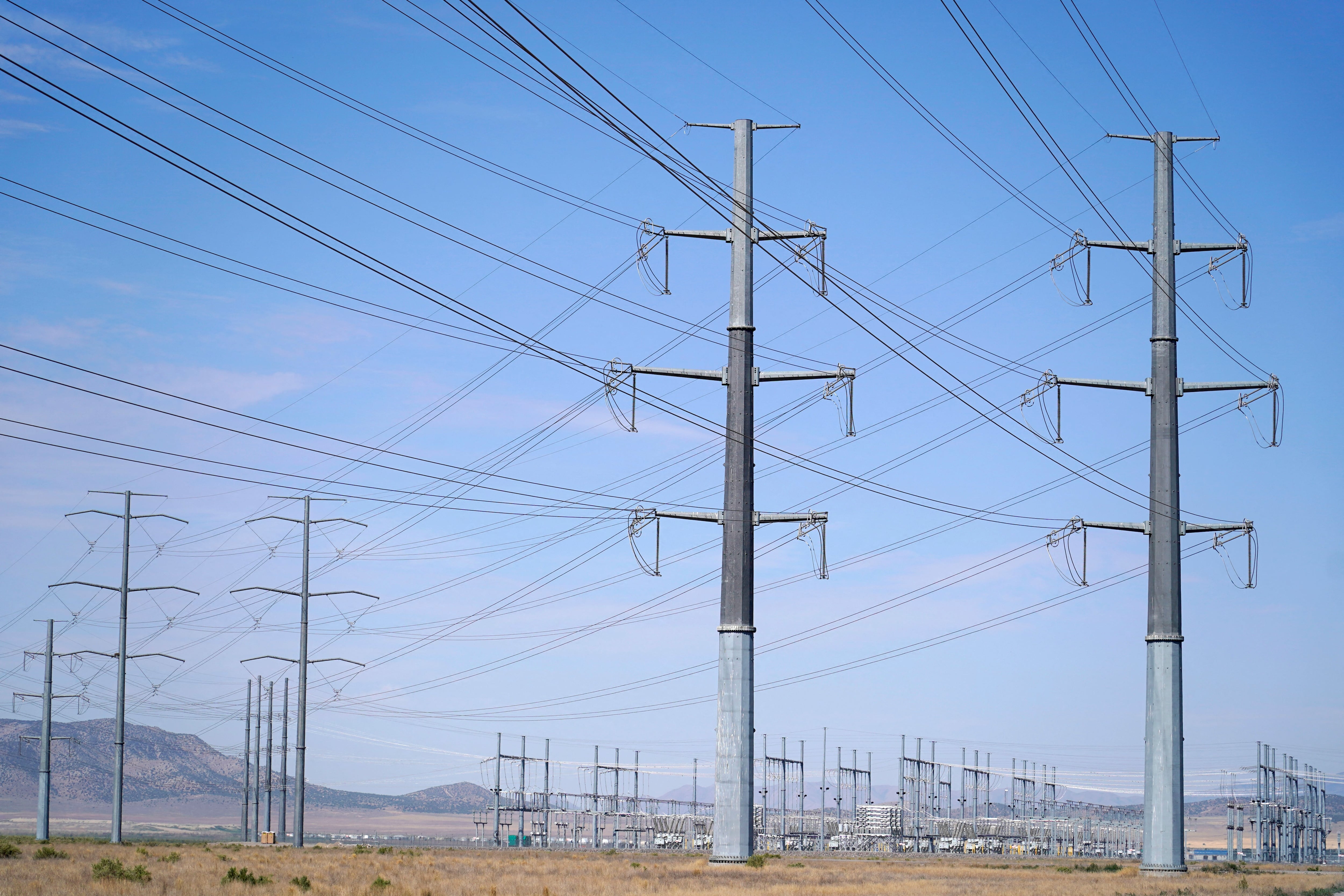 Large electrical transmission lines are routed to Meta's Facebook data center in Eagle Mountain, Utah. The complex consists of five large buildings, each over four football fields long and totaling 2.4 million square feet.