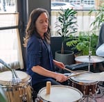 Meg Samples plays the drums.