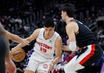 Detroit Pistons forward Simone Fontecchio (19) drives the lane against Portland Trail Blazers forward Deni Avdija, right, during the first half of an NBA basketball game, Monday, Jan. 6, 2025, in Detroit.