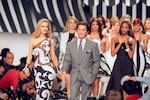 FILE - Italian fashion designer Valentino Garavani walks the catwalk with his models after a fashion show on October 20, 1991 in Paris, France.