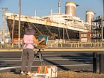 The SS United States' departure from Philadelphia has been delayed by the weather. A team from NPR climbed aboard before it takes its final voyage.