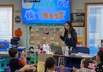 Umatilla teacher Yoshira Escamilla leads her kindergarten class in singing the days of the week. Escamilla teaches at the same school she attended as a child, in the school district she graduated from in 2016.