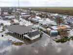 Water surrounds damaged homes in Lafourche Parish, La., after Hurricane Ida in 2021. Many people in Louisiana are still recovering from past hurricanes as this year's hurricane season gets underway. "Anytime we have a community that is still going through a recovery from a previous storm, it just makes them that much more vulnerable," says FEMA Administrator Deanne Criswell.