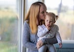Teela Banister holds her 18-month old daughter Lakelynn, at their rural home in Baker City, Ore. Baker City’s maternity ward closed in 2023, so when Bannister went into labor, she and her husband had to drive an hour to a hospital. Lakelynn was born on the drive.