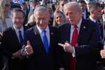 FILE - President Donald Trump poses for a photo with Israel's Prime Minister Benjamin Netanyahu before he boards Air Force One at Ben Gurion International Airport, Oct. 13, 2025, near Tel Aviv, as Israel's President Isaac Herzog watches at left.