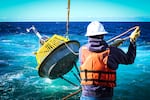 A NOAA ocean buoy is deployed in the Pacific Ocean in 2022.