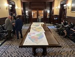 Maps for new congressional districts in South Carolina are shown in the South Carolina Senate antechamber on Friday.