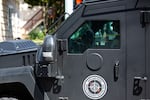 The Portland Police Bureau's Specialty Emergency Reaction Team, or SERT, responds to a person believed to be armed barricaded inside a home in the Sellwood neighborhood of Portland, Ore., Sunday, June 28, 2020.