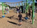 Children play on the playground during recess at Orchard Hill Elementary School in Medford, Ore., on Sept. 2, 2025.