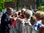 Slovakia's Prime Minister Robert Fico, center, speaks with people before a cabinet meeting in the town of Handlova, Slovakia, on Wednesday.