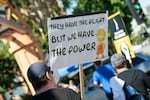 Members of the Writers Guild of America and SAG-AFTRA walk the picket line outside of Disney Studio, in Burbank, California, on Aug. 16.