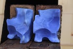 The blocks of salt licks that are auctioned off at the Great Salt Lick auction and contest vary not only in shape and size but also in color, depending on the content of minerals and vitamins they contain. This undated photo provided by Deschner shows a pair of salt licks that were auctioned off that contained cobalt, giving them a distinctive blue hue.