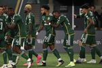 Portland Timbers midfielder Eryk Williamson (19), center, celebrates with teammates after scoring a goal against the Colorado Rapids during the first half of an MLS soccer match, Saturday, Feb. 24, 2024, in Portland, Ore.