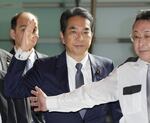 Japan's Agriculture Minister Taku Eto, center, arrives at the prime minister's office in Tokyo on Wednesday, May 21, 2025.