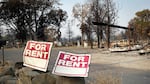 Rent signs near a mobile home park in Phoenix that was entirely destroyed by the Almeda Fire.