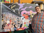 Lieber stands with a 6ft wide reproduction illustration from Superman’s Pal, an homage to a Superman cover from the 1970s.