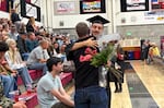 Perrydale graduate Gavin Lieuallen hugs science teacher Brock Ferguson at Perrydale High’s graduation on June 6, 2026 in Amity, Ore. Perrydale is one of 19 Oregon school districts with a 100% graduation rate in 2025.