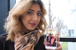 Iraqi refugee Noor Hilmi holds a picture of her parents, who are visiting Dubai. She’s been worried they won’t be let back in for 90 days.