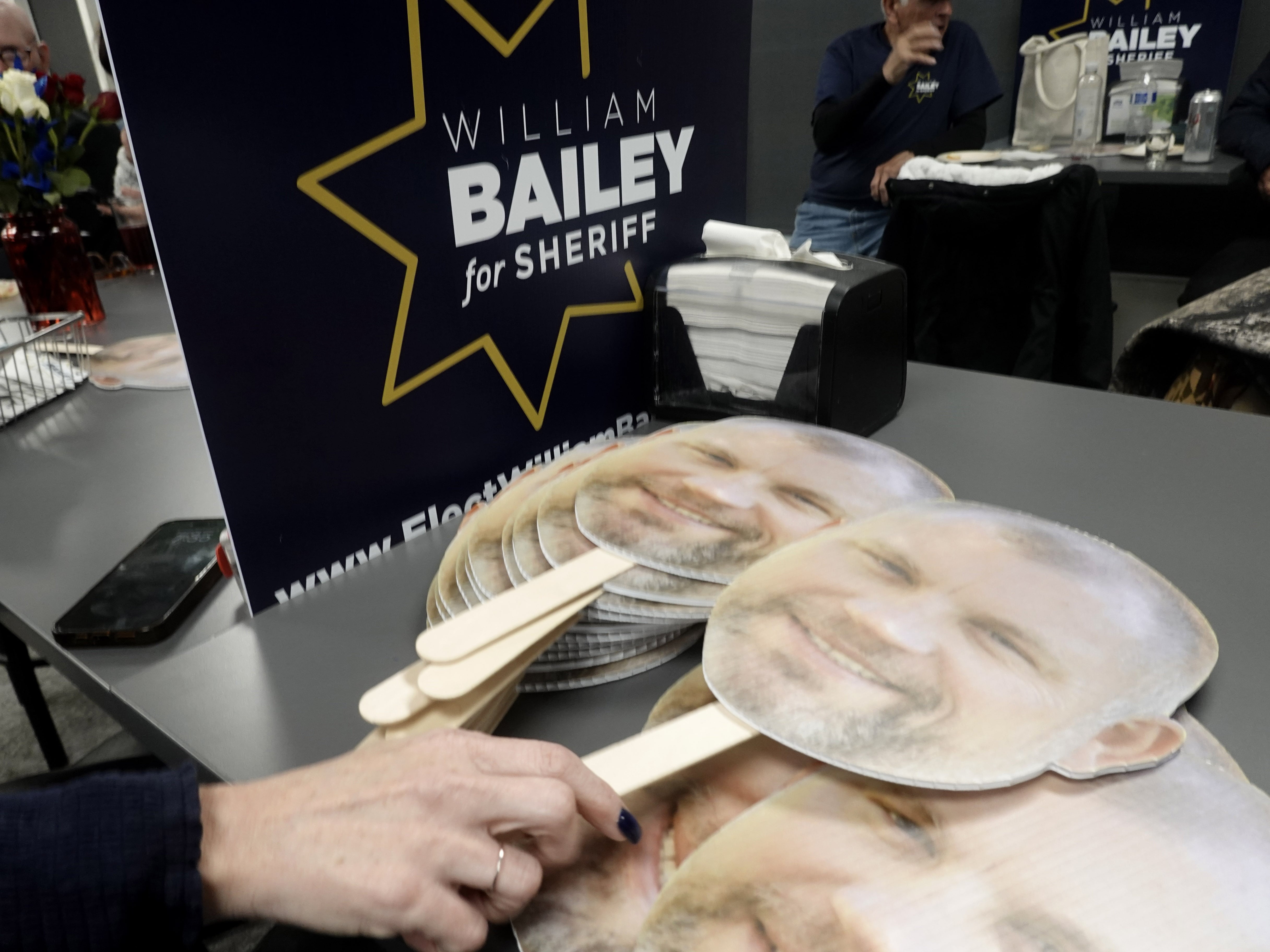 Signs with the candidate’s face at an election results party for Deschutes County Sheriff candidate William Bailey, Nov. 5, 2024.