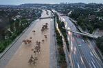 An aerial view of the Los Angeles River swollen by runoff from a long-duration atmospheric river storm in February of 2024 in Los Angeles, California.