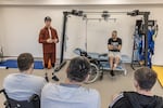 Oleksandr Budko, whose military call sign is Teren, talks to injured soldiers at the Recovery rehabilitation center in Kyiv, Ukraine, on Oct. 18.