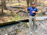 FILE - Collin Haffey, the post-fire recovery manager for the Department of Natural Resources, stands in front of the Yakima-Tieton Irrigation Canal. The canal is a vital resource for the Yakima Valley.
