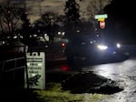 A “frog taxi” arrives on Harborton Drive in Northwest Portland after transporting red-legged frogs safely across U.S. Highway 30 in March.