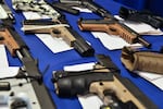 "Ghost guns" seized in federal law enforcement actions are displayed at the Bureau of Alcohol, Tobacco, Firearms and Explosives field office in Glendale, Calif., in April 2022.