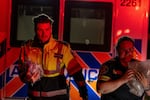 Paramedics work at the Wainwright Health Centre as injured military members are treated after a fire at Canadian Forces Base Wainwright, outside of Wainwright, Alberta Saturday, Oct. 17, 2026.