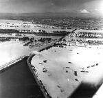 An aerial view of the breach in the railroad berm that caused the Vanport flood. The berm was engineered to support railroad tracks, not to hold back large amounts of water like a dike or a levy would. Smith Lake is to the west (left) of the breach. Vancouver, WA and Mt. St. Helens are visible to the north.