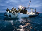 Sailors recover a high-altitude surveillance balloon in the waters off the coast of Myrtle Beach, S.C., on Feb. 5, after a fighter jet shot the balloon out of the sky.