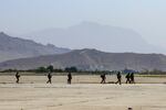 In this image provided by the U.S. Army, paratroopers assigned to the 1st Brigade Combat Team, 82nd Airborne Division conduct security operations as they continue to help facilitate the evacuation at Hamid Karzai International Airport in Kabul, Afghanistan on Wednesday, Aug 25, 2021. Attacks at the airport on Thursday morning killed 60 Afghans, and 12 U.S. troops