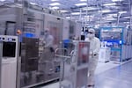 A photo from November 2021 shows employees in cleanroom "bunny suits" working at Intel's D1X factory in Hillsboro, Oregon. Intel is among the companies to partner with PSU in offering semiconductor internships to students studying math or chemistry.