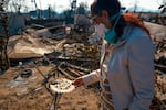 Margaret Larkin holds a piece of her Christmas decor from last year. Larkin lived on her block in Altadena, Calif. for 36 years. Her home burned down in the Eaton Fire.