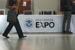 People arrive at an ICE recruitment job fair at the Utah Valley Convention Center in Provo, Utah on Sept. 15.