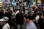 People walk in Tehran's traditional main bazaar, Iran, Saturday, Aug. 8, 2026.