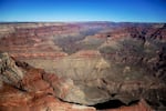 The Grand Canyon National Park is covered in the morning sunlight as seen from a helicopter near Tusayan, Ariz., on Oct. 5, 2013.