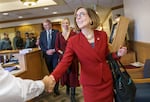 FILE: Outgoing Gov. Kate Brown greets people as she arrives for the inauguration of Tina Kotek as Oregon governor in Salem in 2023.