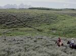 Jake Hutton leads a visitor past a spring on the Kelly Parcel.