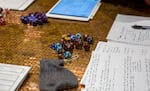 Players pull out their dice in preparation for a game of Dungeons and Dragons. The game use various dice rolls to move the story forward and determine if an action succeeds or fails.