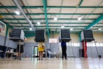 FILE - Voters cast their ballots during the primary election in Windsor, Conn., Aug. 11, 2026.