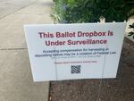 Signs like this one at the Broadview library branch in north Seattle popped up at some King County ballot drop boxes in July. They prompted concerns about voter intimidation and ultimately an investigation by the King County Sheriff's Office.
