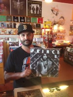 A customer at Jackpot Records buys the last remaining Prince album in stock on April 21, 2016.  