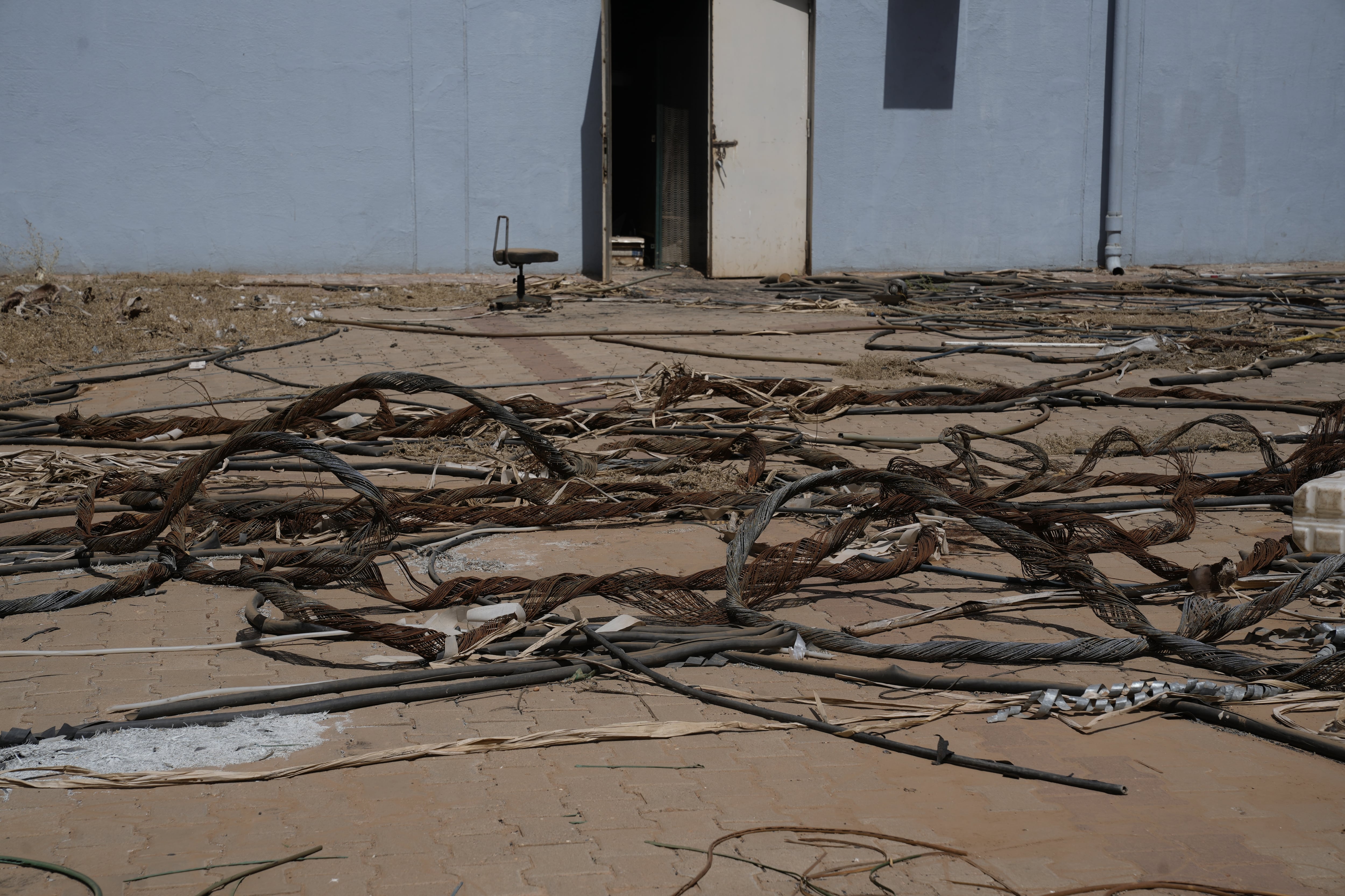 Plastic is all that remains of electric cables at the Ibn Sina Specialist Hospital in Khartoum that were stripped for copper. The hospital was occupied by the RSF.