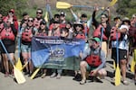 Anibal Rocheta kneels in the foreground of a group photo before the rafts launch onto the Lower Deschutes River, July 8, 2023.