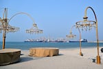 Ships are docked along a pier at the Khor Fakkan Container Terminal, the only natural deep-sea port in the region and one of the major container ports in Sharjah Emirate, along the Gulf of Oman on July 14, 2026.