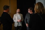 Paul Katami (center left), a plaintiff in the landmark 2010 lawsuit that overturned California's ban on same-sex marriage, greets fellow plaintiffs Kris Perry (center right) Sandy Stier (right),and KQED Politics Editor Scott Shafer (left) ahead of an interview at the KQED offices in San Francisco on March 3.