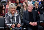 FILE - Phil Knight, right, and Penny Knight, watch the first half of an NCAA college basketball game in the Phil Knight Invitational tournament in Portland, Ore., Nov. 26, 2017.