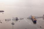 In an aerial view, cargo ship Dali is seen after running into and collapsing the Francis Scott Key Bridge.