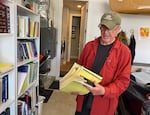 Al Johnson looks at some of the old documents he has stored away from his career as a land use lawyer in Oregon, at his home in Eugene, June 2021.